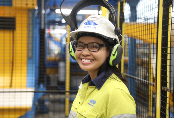 BlueScope employee with ear protection in facility