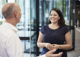 Two BlueScope employees having conversation in an office