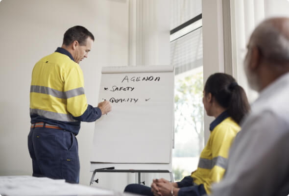 BlueScope employee outlining a meeting agenda on a flipchart